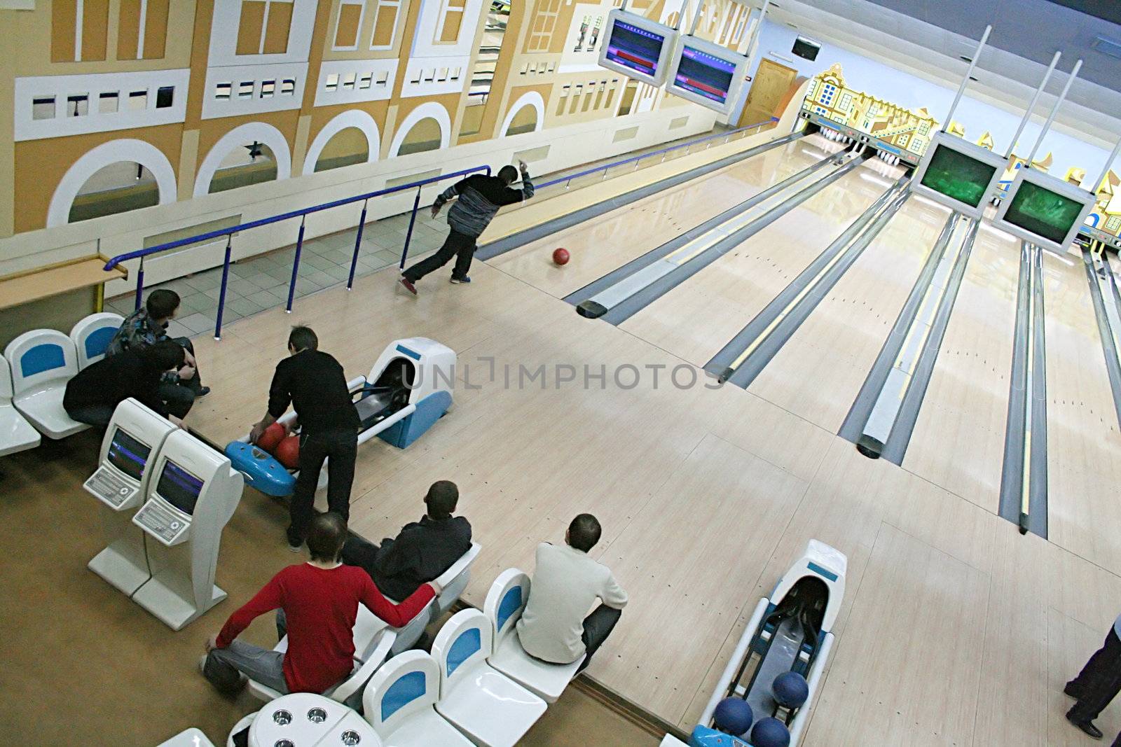 Neat throw of a red sphere in bowling