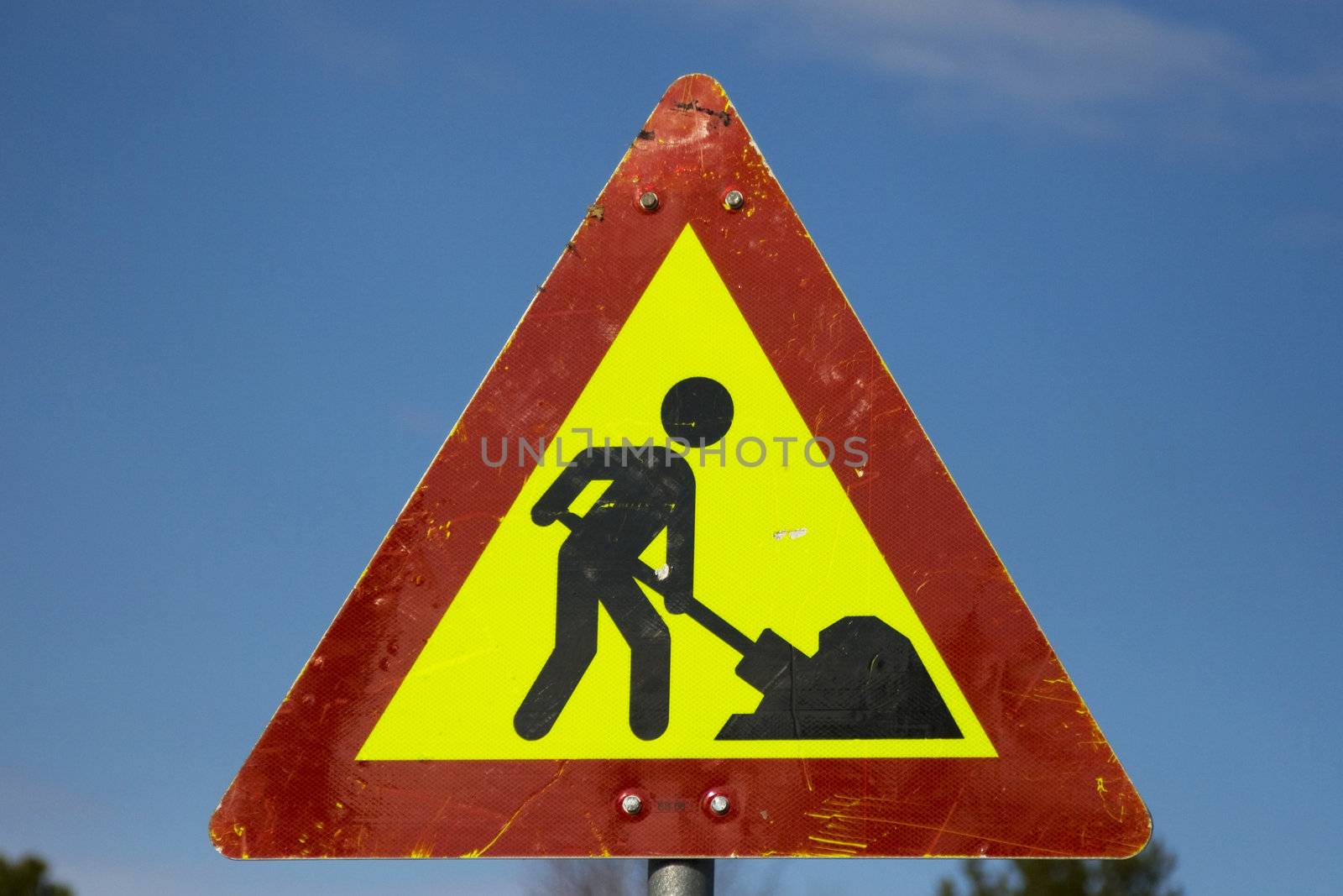 A vivid street work sign with good texture.