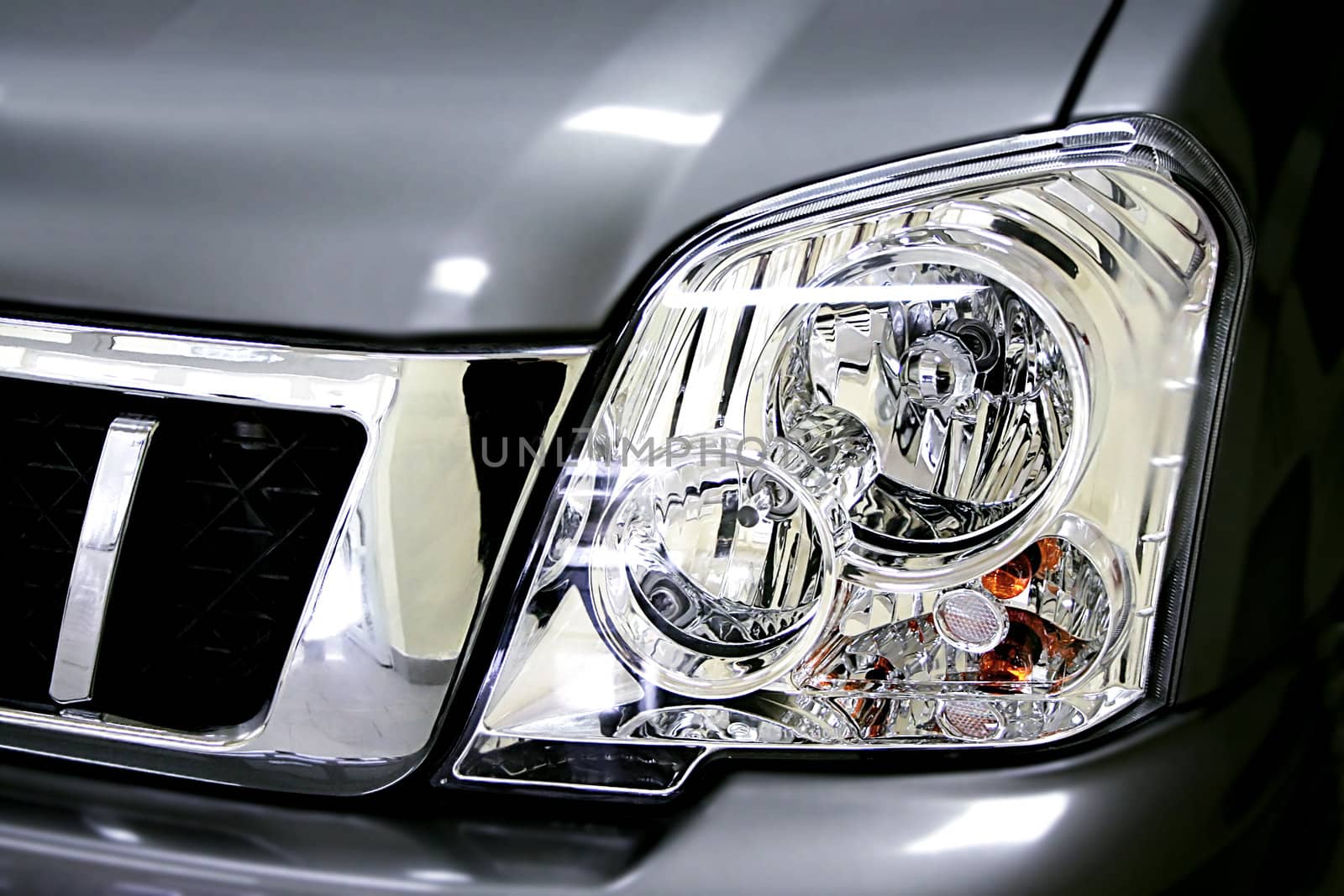 Beautiful headlight of the grey sports car