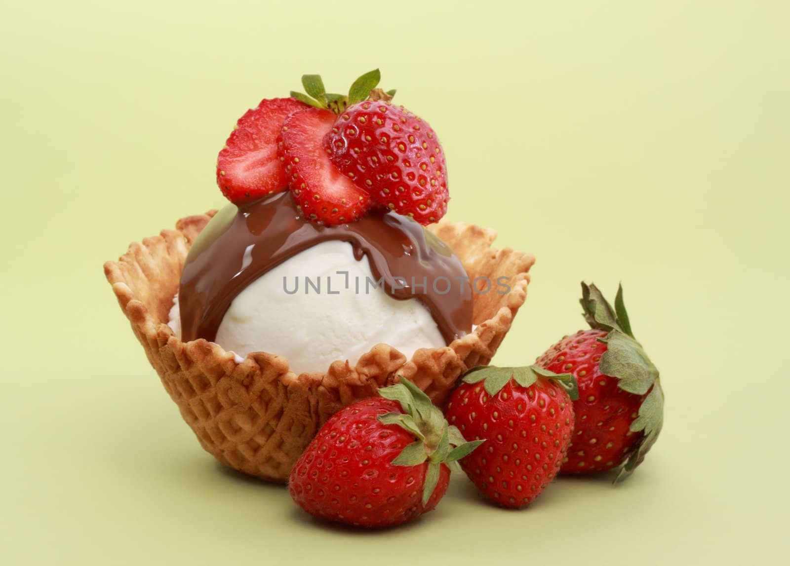ice cream dessert with strawberries and chocolate