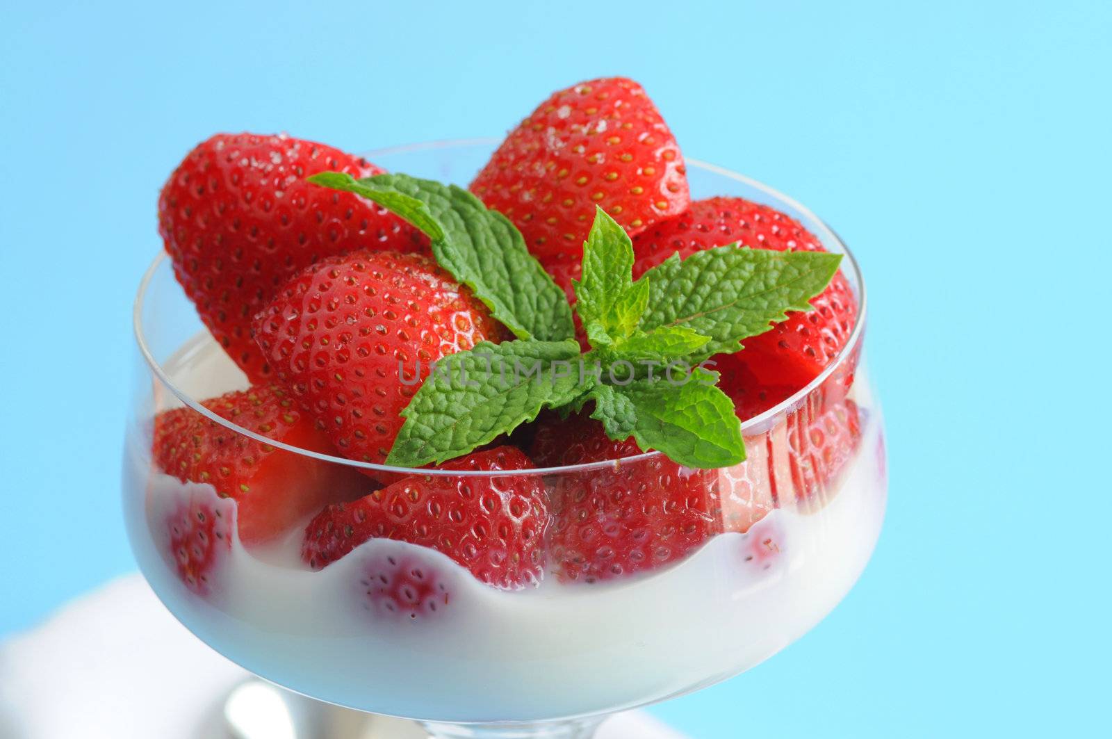 Fresh sliced Strawberries served with cream and sugar.