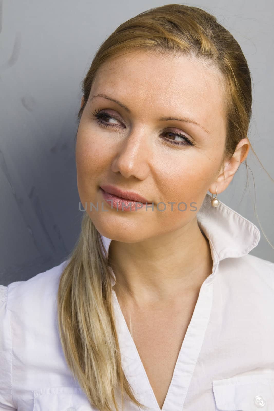 Portrait of young beautiful happy thinking woman