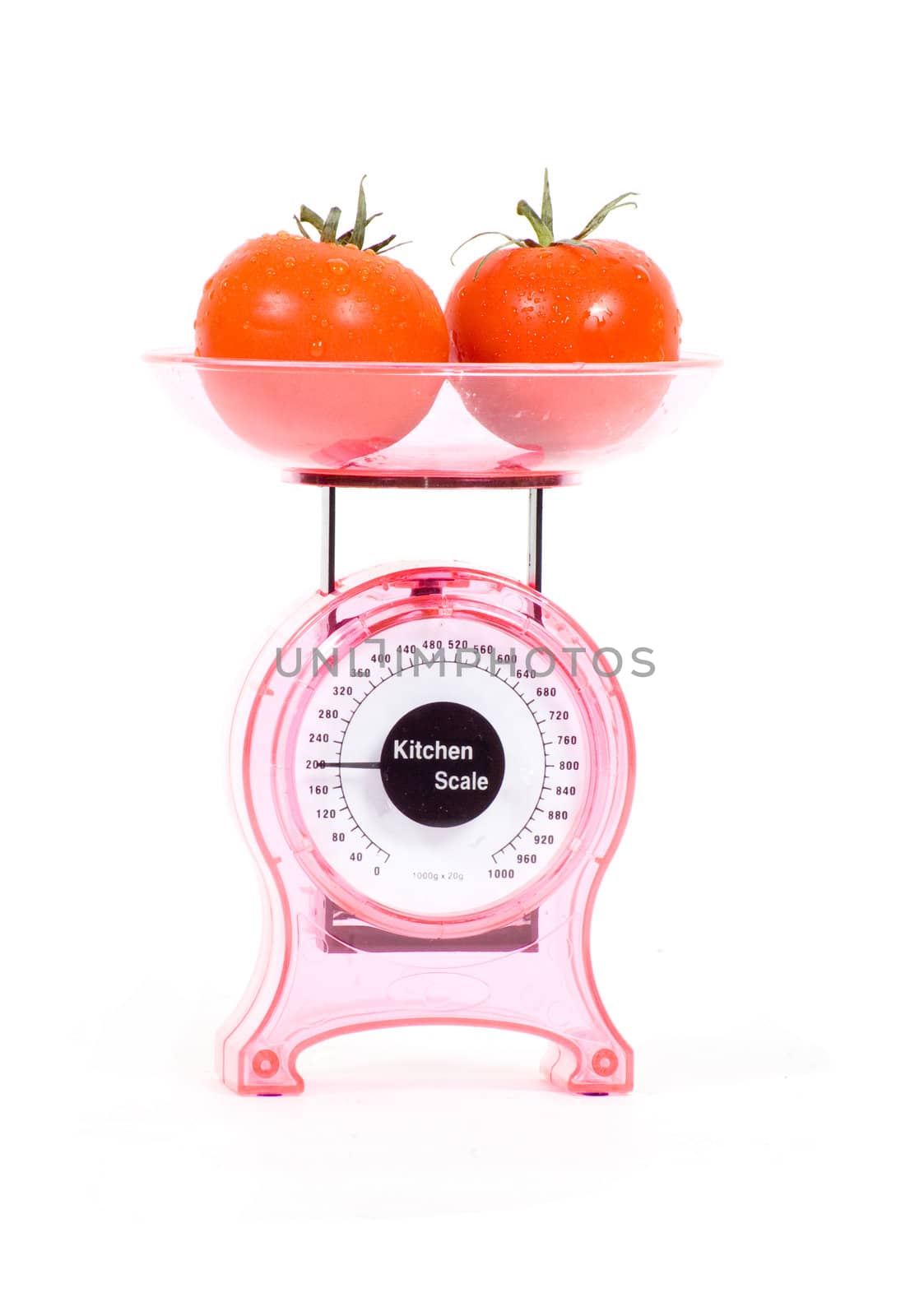 Kitchen Scales with fresh tomatoes isolated over white