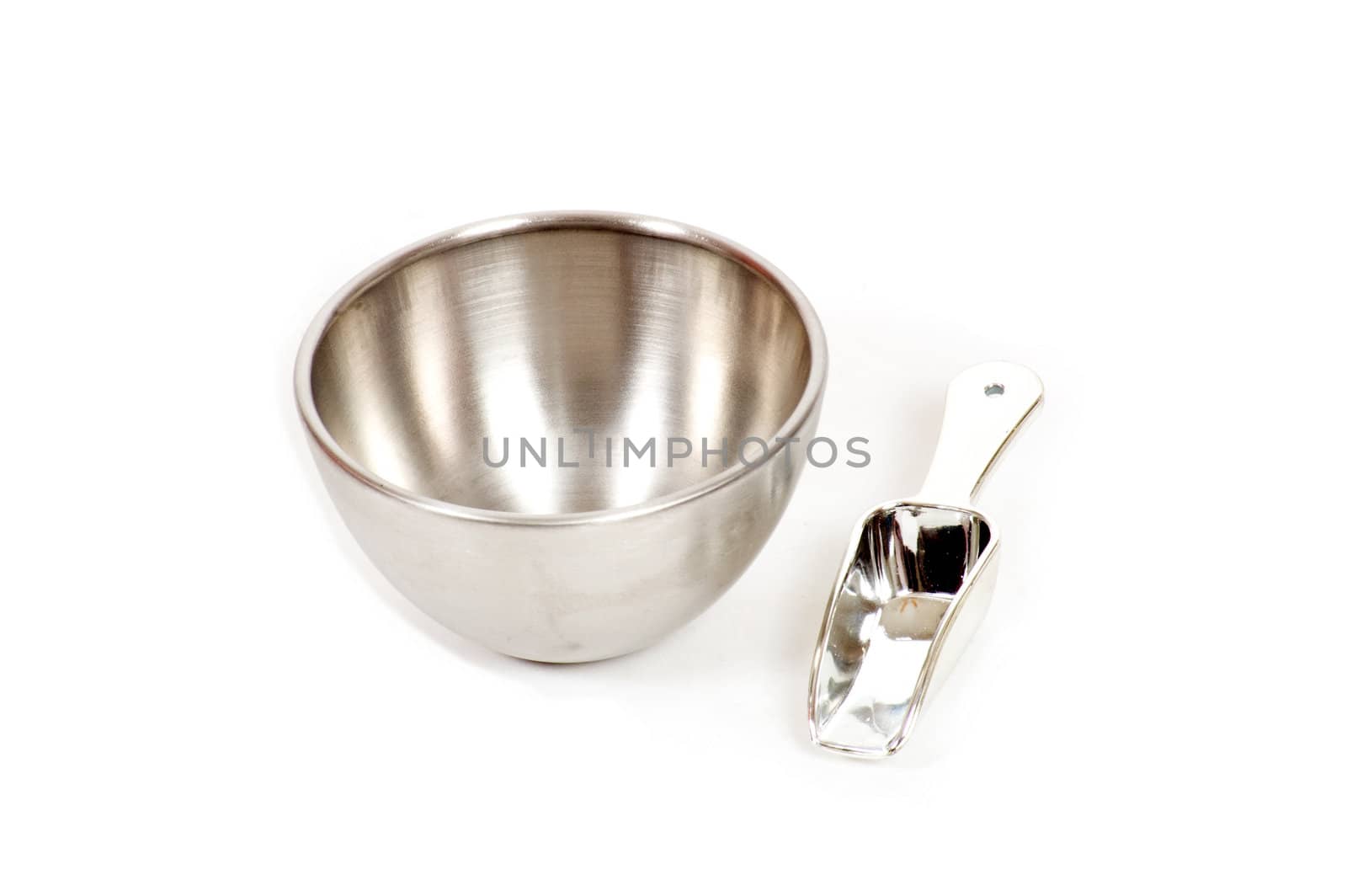 silver bowl with measuring scoop isolated on white