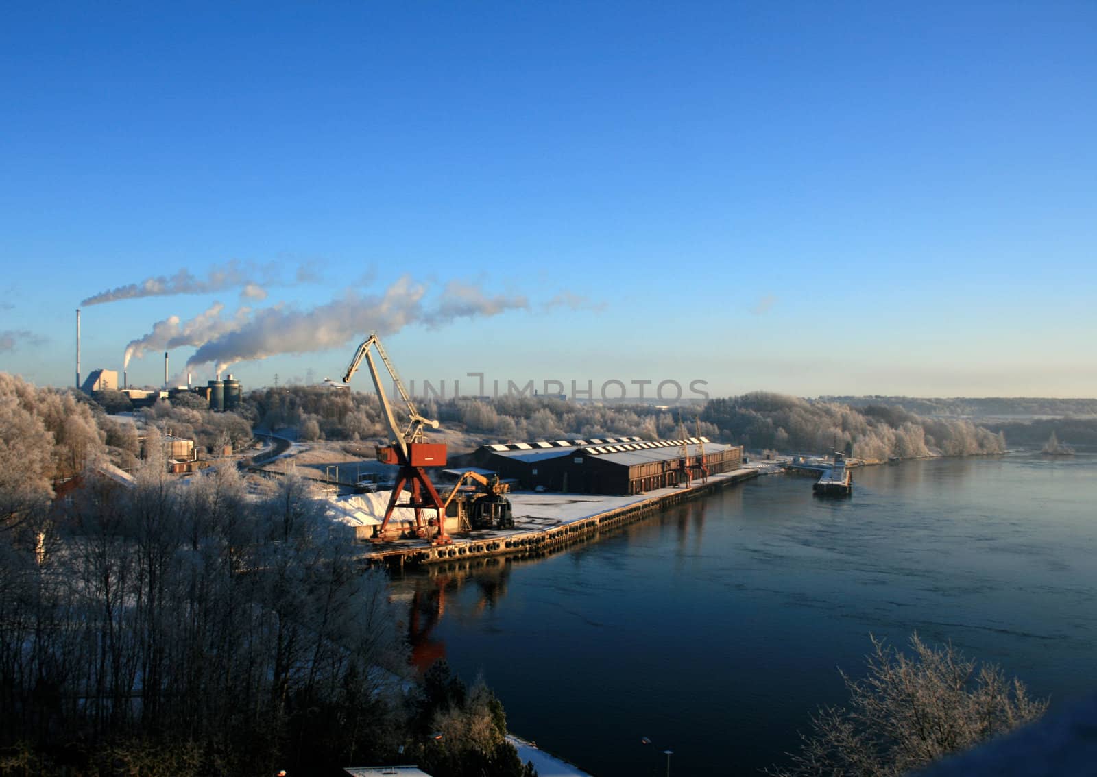 A quiet winter day at the harbour close to a factory