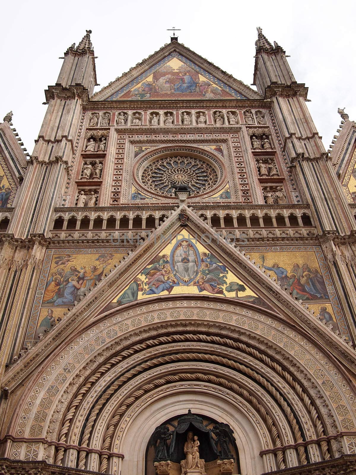 Front view of the mosaics of the gothic cathedral of Orvieto in Umbria, Italy.