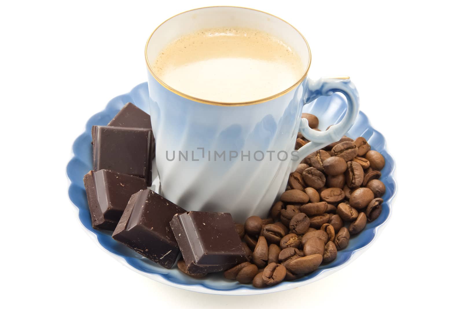 Picture of a small coffe cup with coffee and chocolate and coffe beans on the side