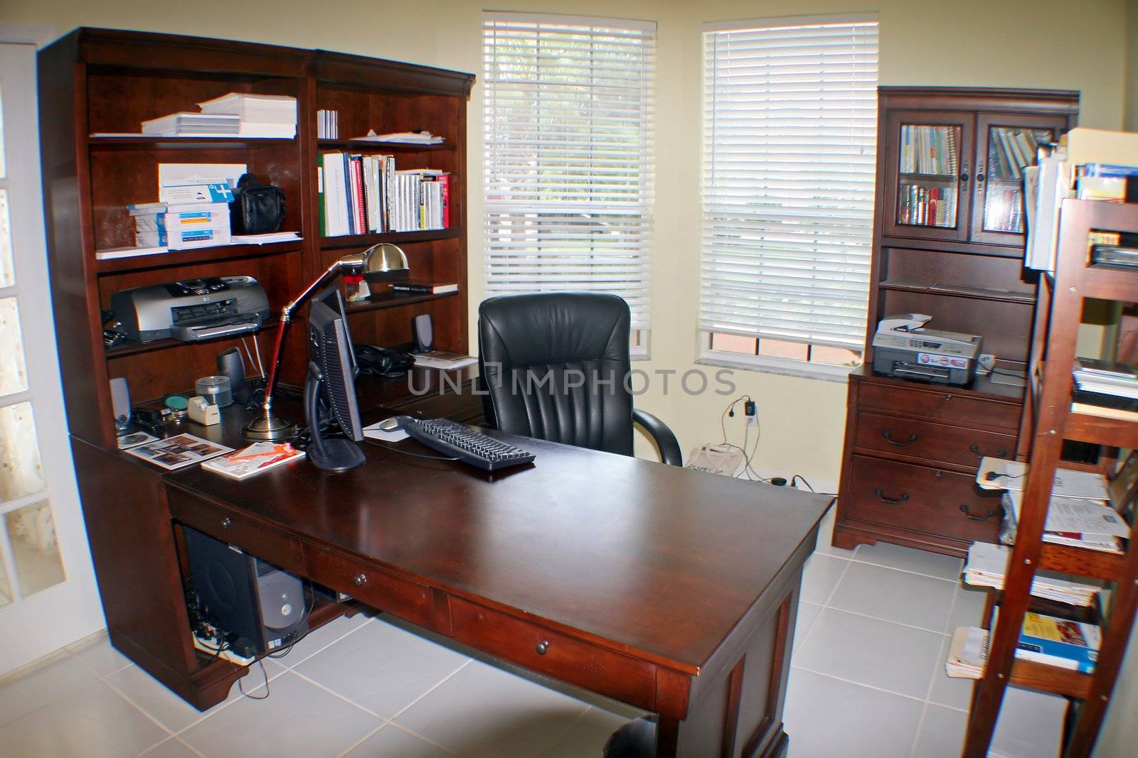 An office in a Florida Home with tile floor.