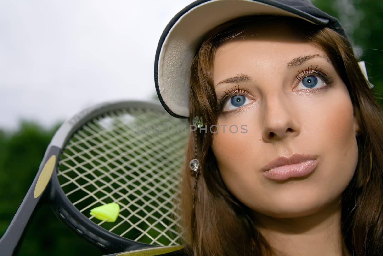 Pretty playing tennis young woman