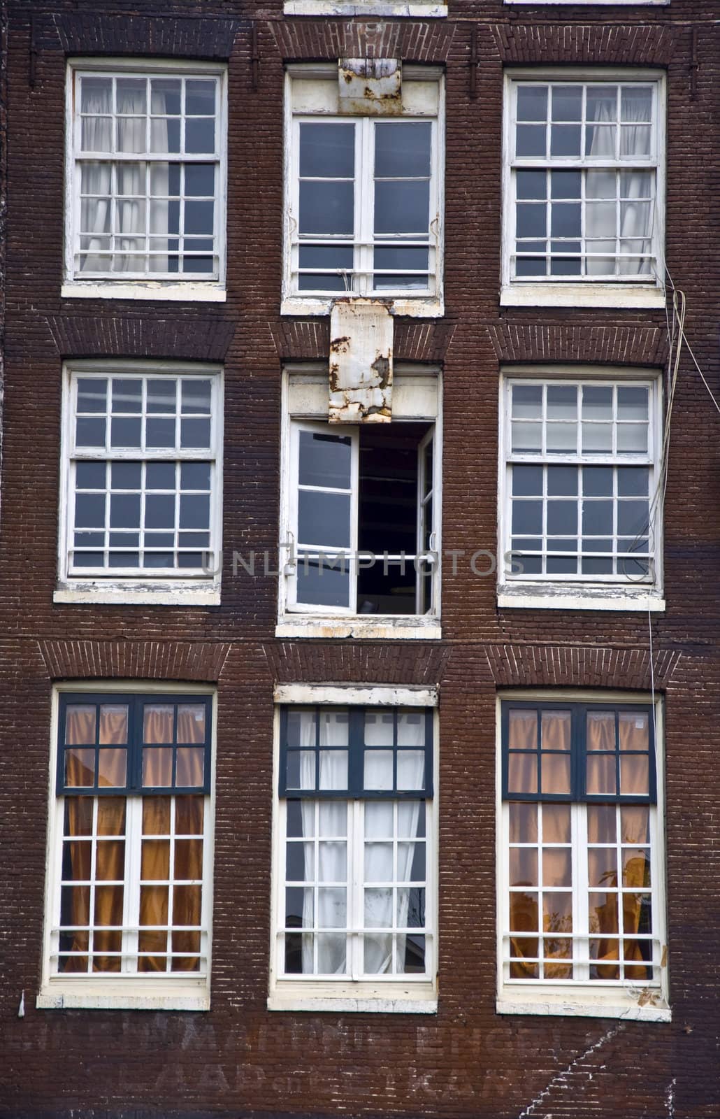 Facade of the Holland house with windows. Amsterdam. Fregment. Frontally