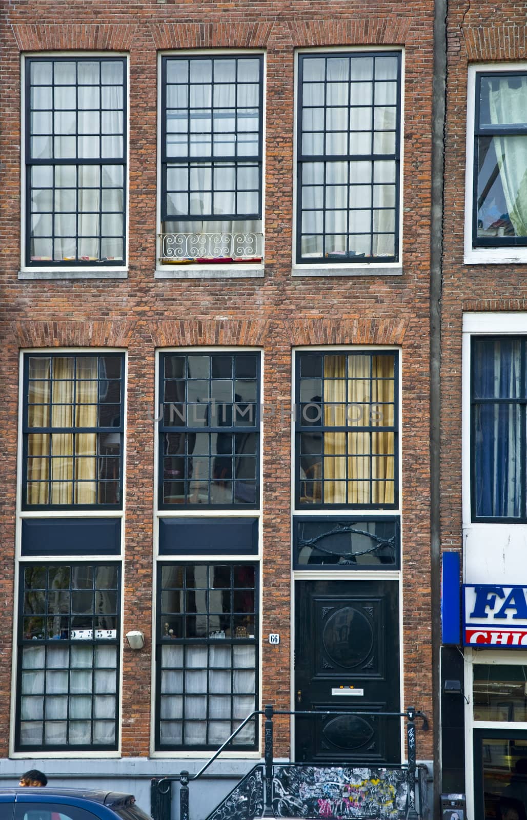 Facade of the Holland house with windows. Amsterdam. Fregment. Frontally