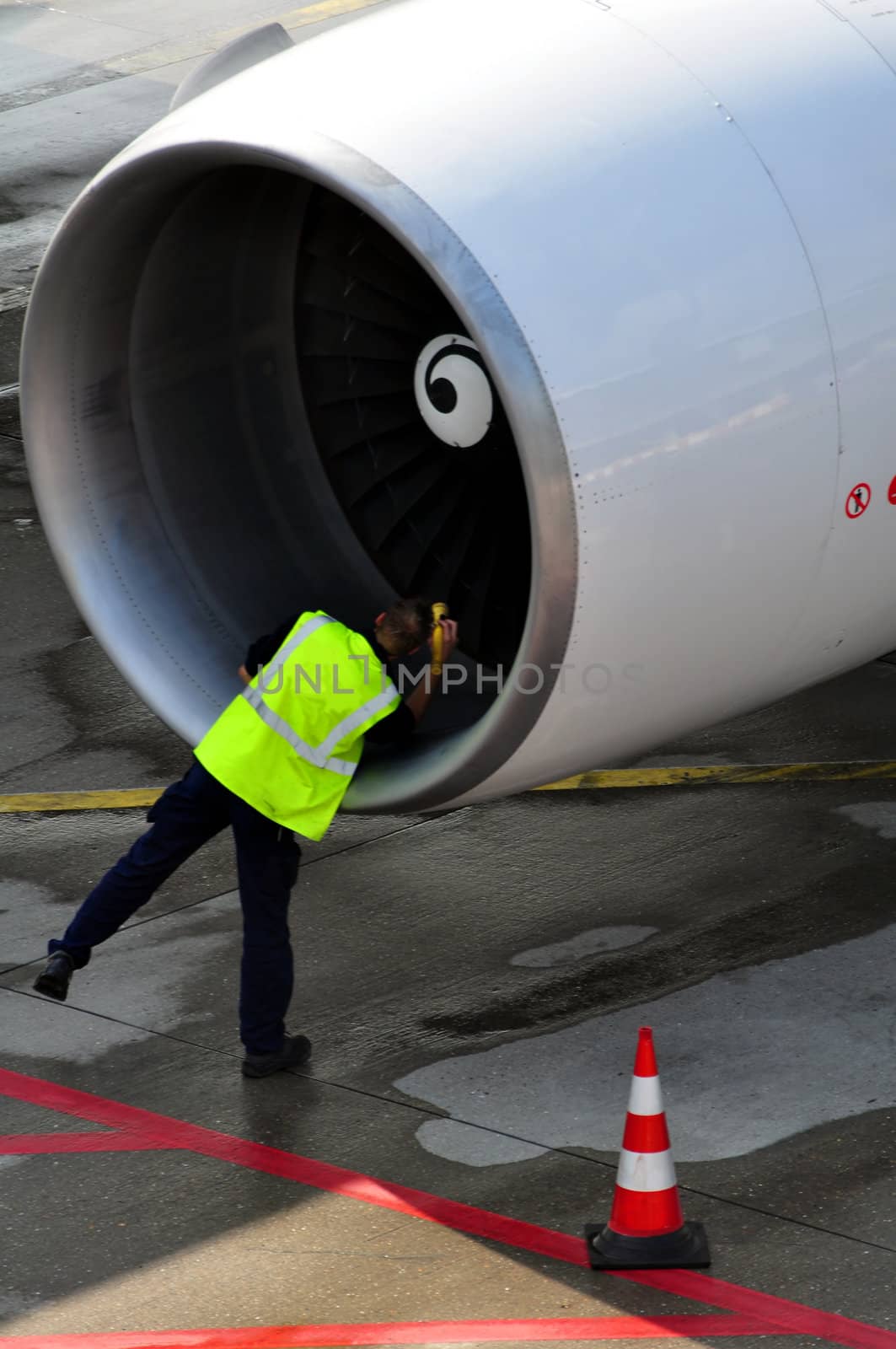 Engineer inspects aircraft engine shortly after arrival