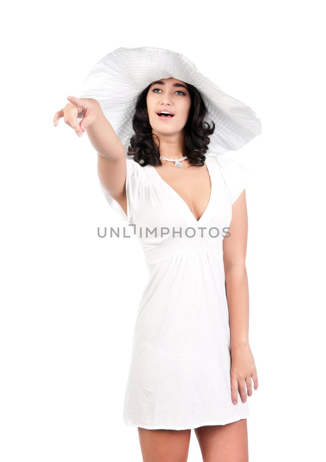 beautiful young fashion woman in white dress and hat pointing