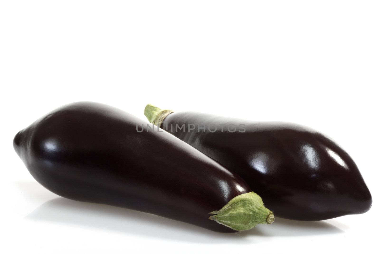 Two fresh eggplants on white background