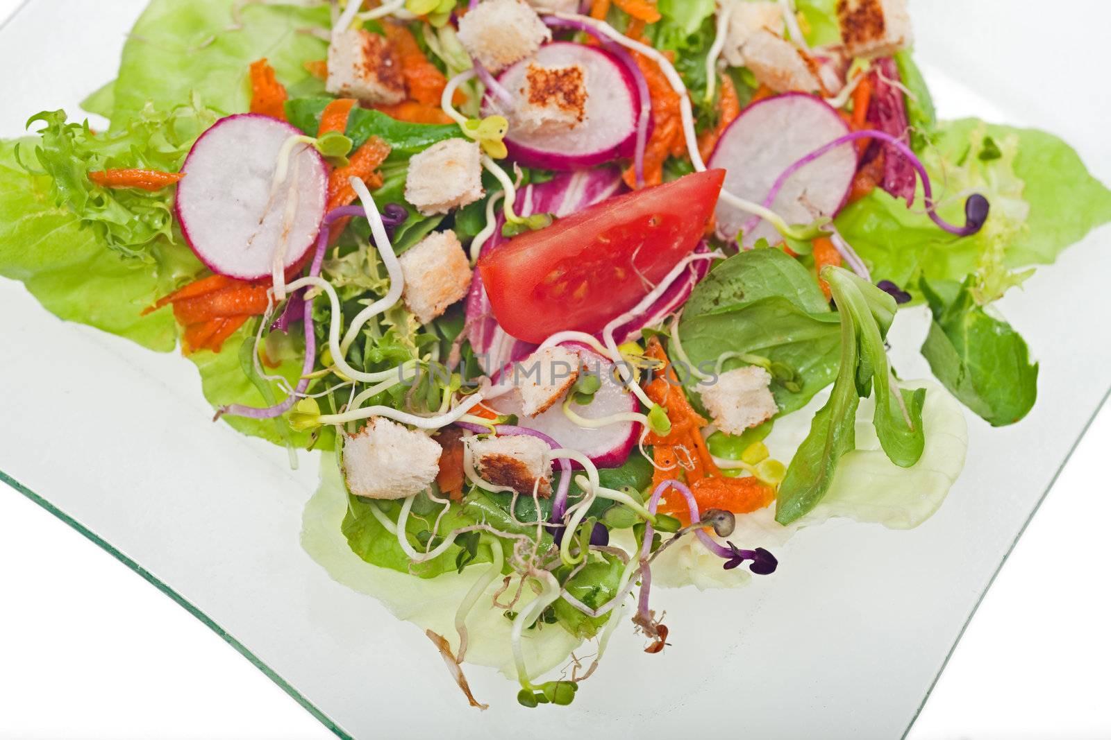 mixed salad on a glass plate by bernjuer