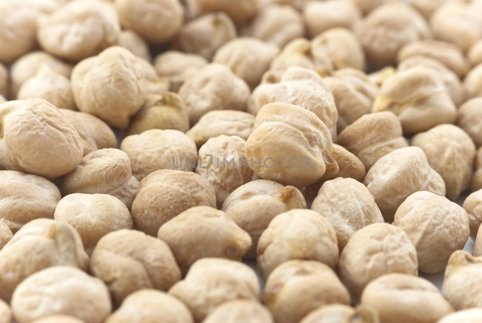 Close-up (macro) of chickpeas (garbanzo beans) filling whole frame.