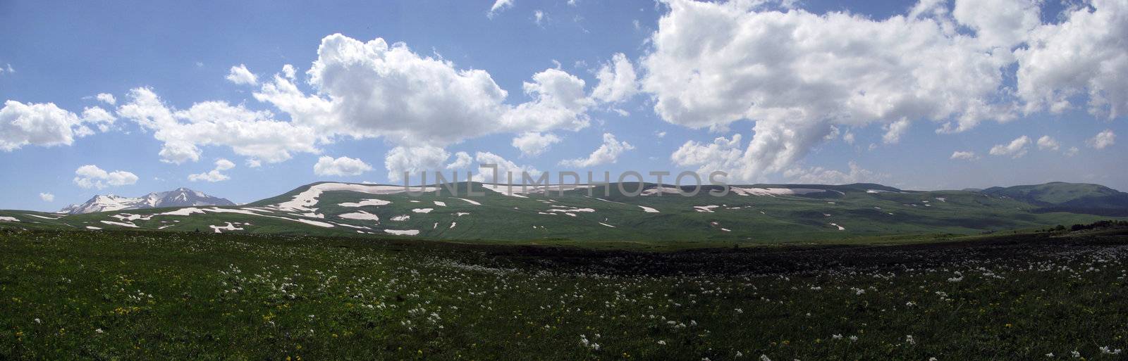 Mountains; rocks; a relief; a landscape; a hill; a panorama; Caucasus; top; a slope; a snow