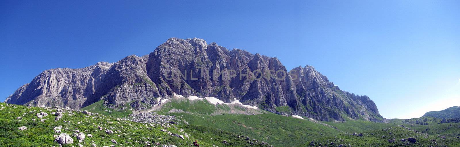 Mountains; rocks; a relief; a landscape; a hill; a panorama; Caucasus; top; a slope; a snow
