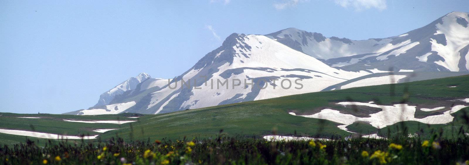 Mountains; rocks; a relief; a landscape; a hill; a panorama; Caucasus; top; a slope; a snow