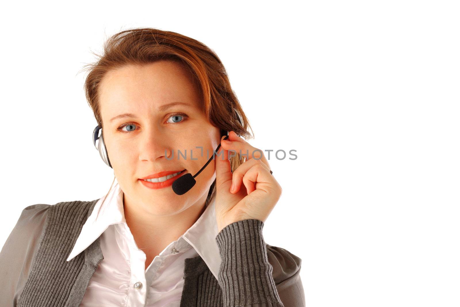 Closeup portrait of a young woman with headset smiling friendly, isolated over white background