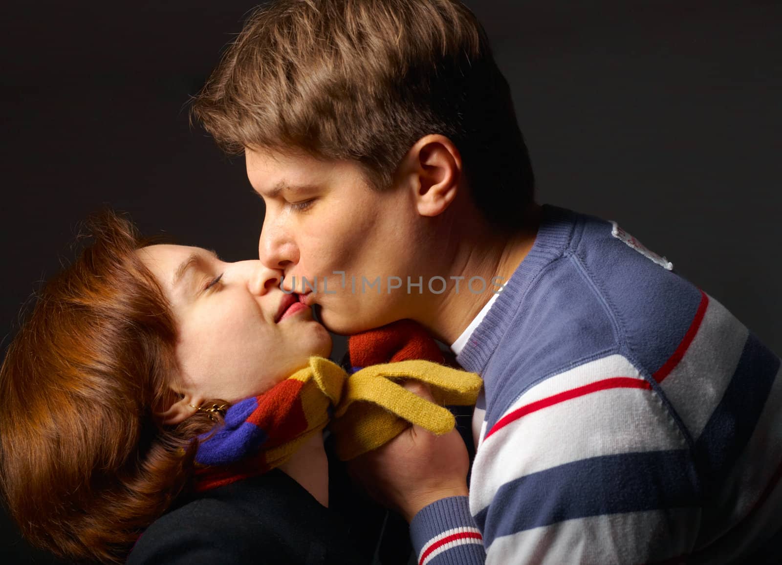 The young man kissing the woman