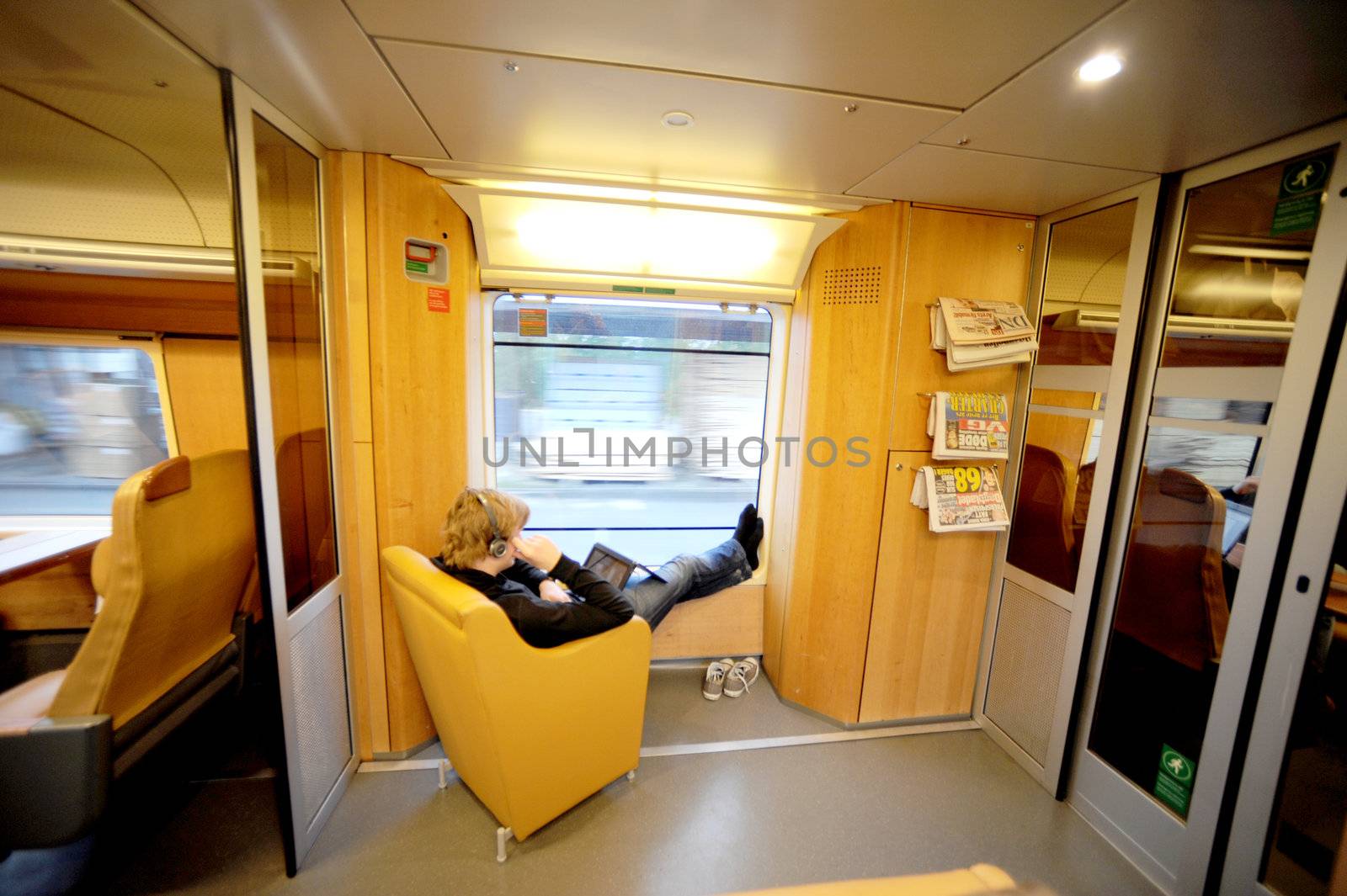 yang man sits in the Norwegian train