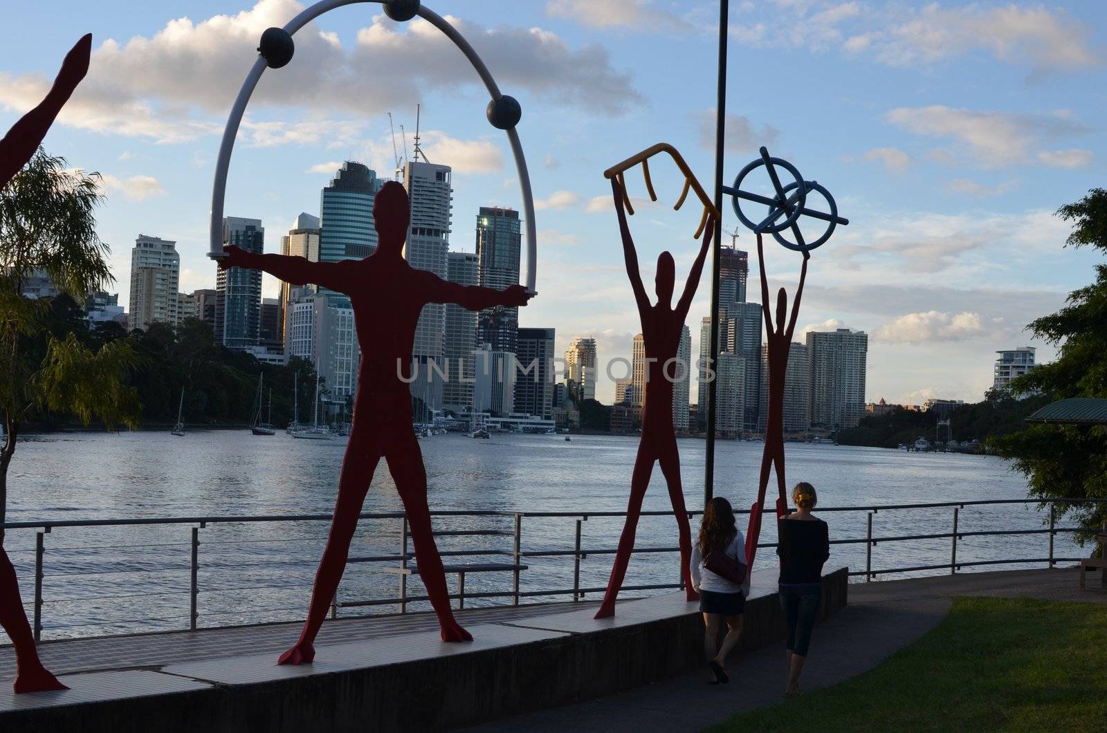 Riverside sculptures on the South Bank of the Brisbane River. On the opposite bank is the city of Brisbane.