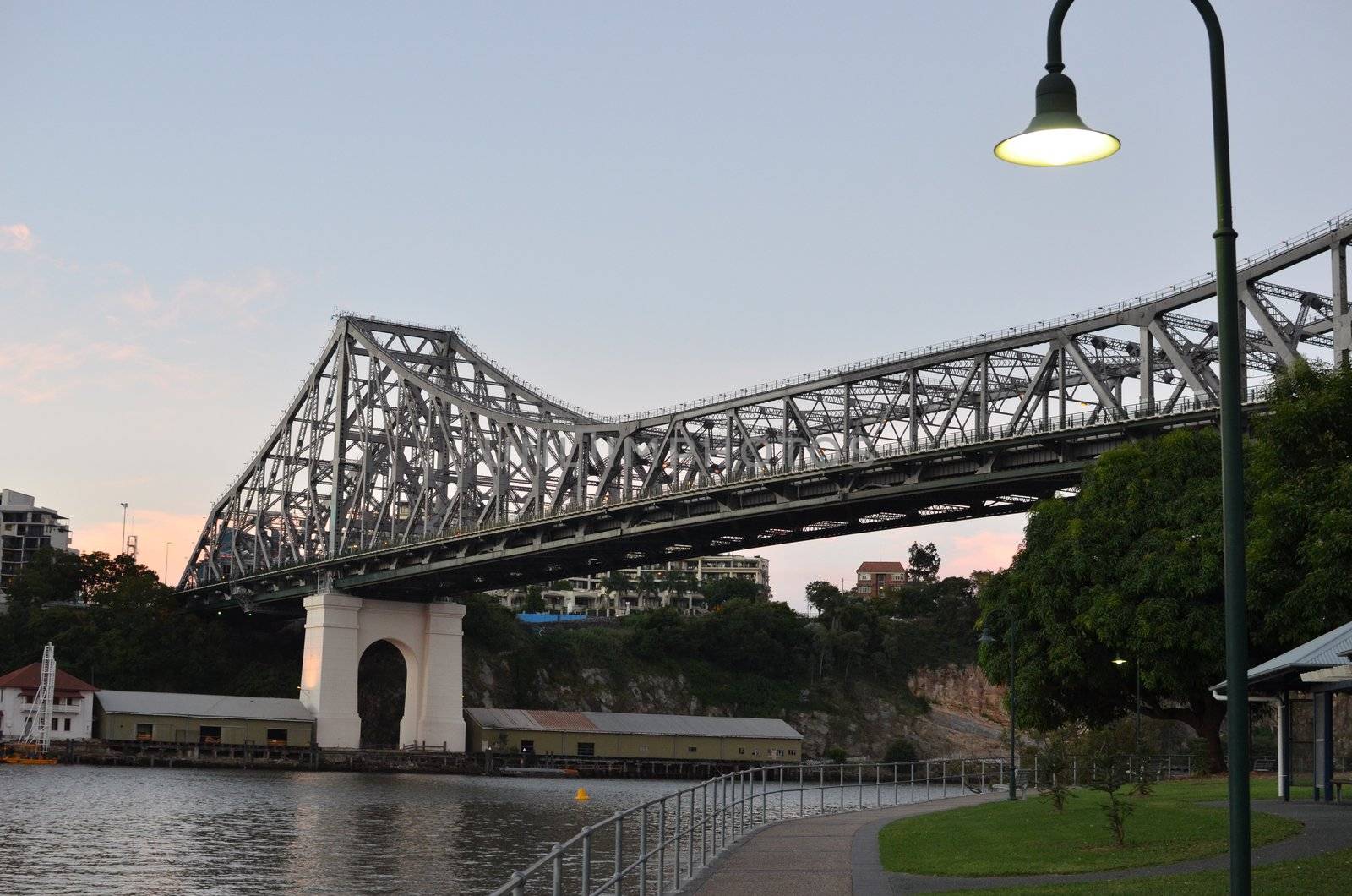 The Brisbane Story Bridge. Photo taken from the south bank in the early evening. The street light in the foreground had just illuminated.