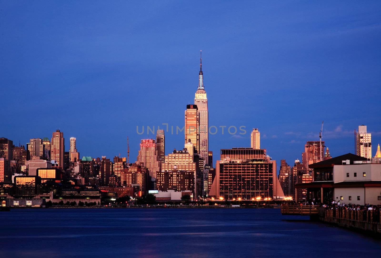 The Empire State Building lighting up red, white, and blue by gary718