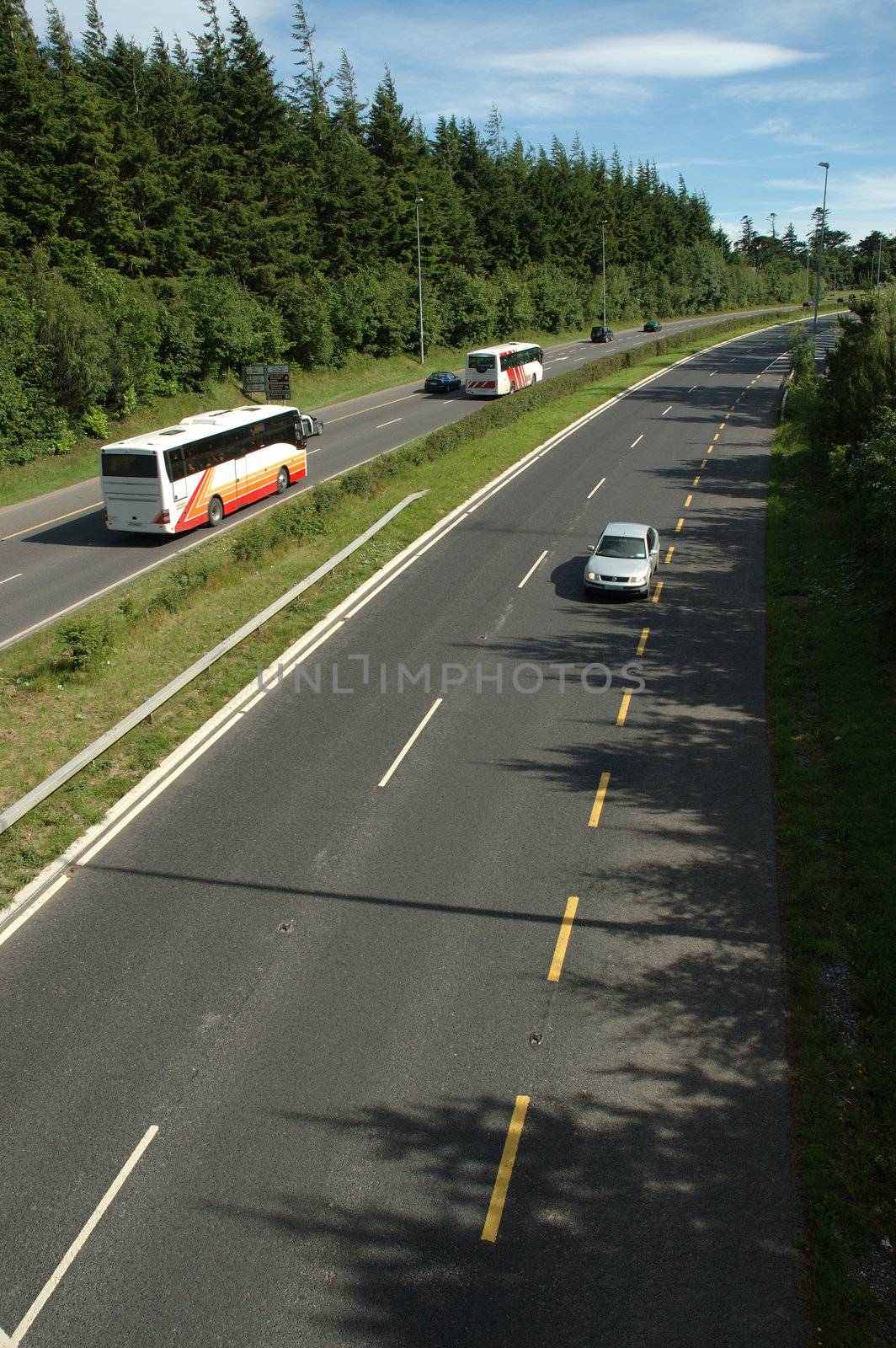 Bus and cars on Motorway by sjeacle