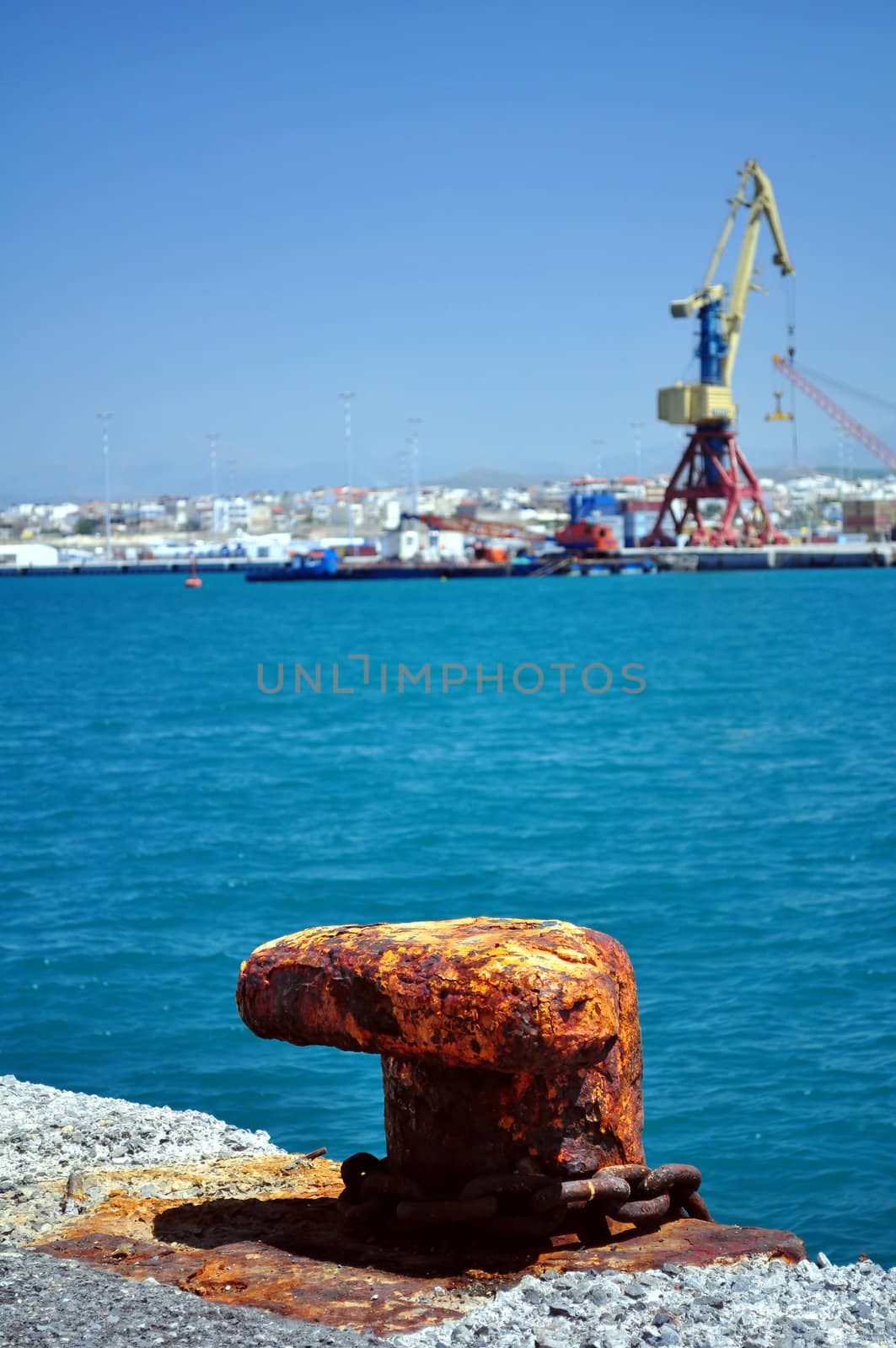 Travel photography: Old rusty cleat in the Mediterranean port of Heraklion, Crete, Greece