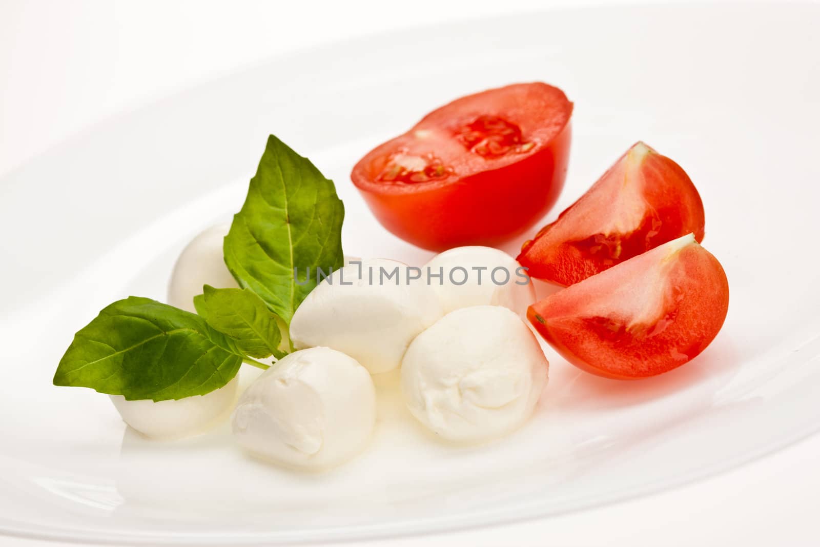 food series: mozzarella, tomato and basil over white