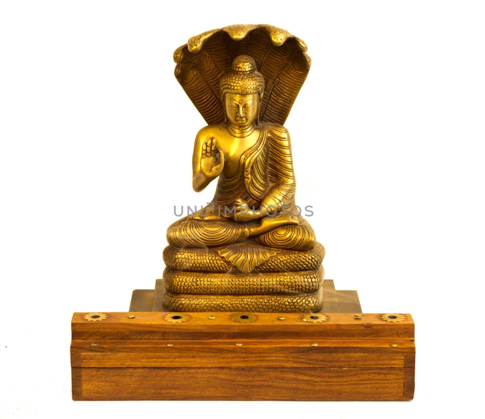 A buddha statue with incense burning in front.