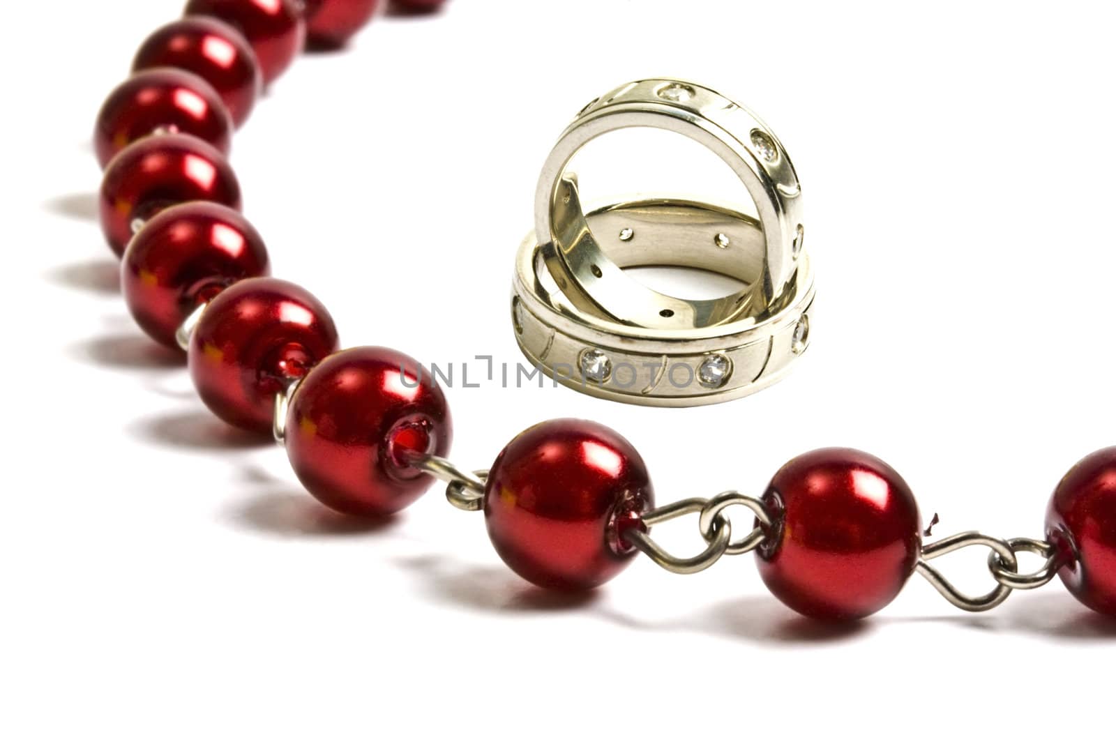 Beautiful red string of beads and rings by ibphoto