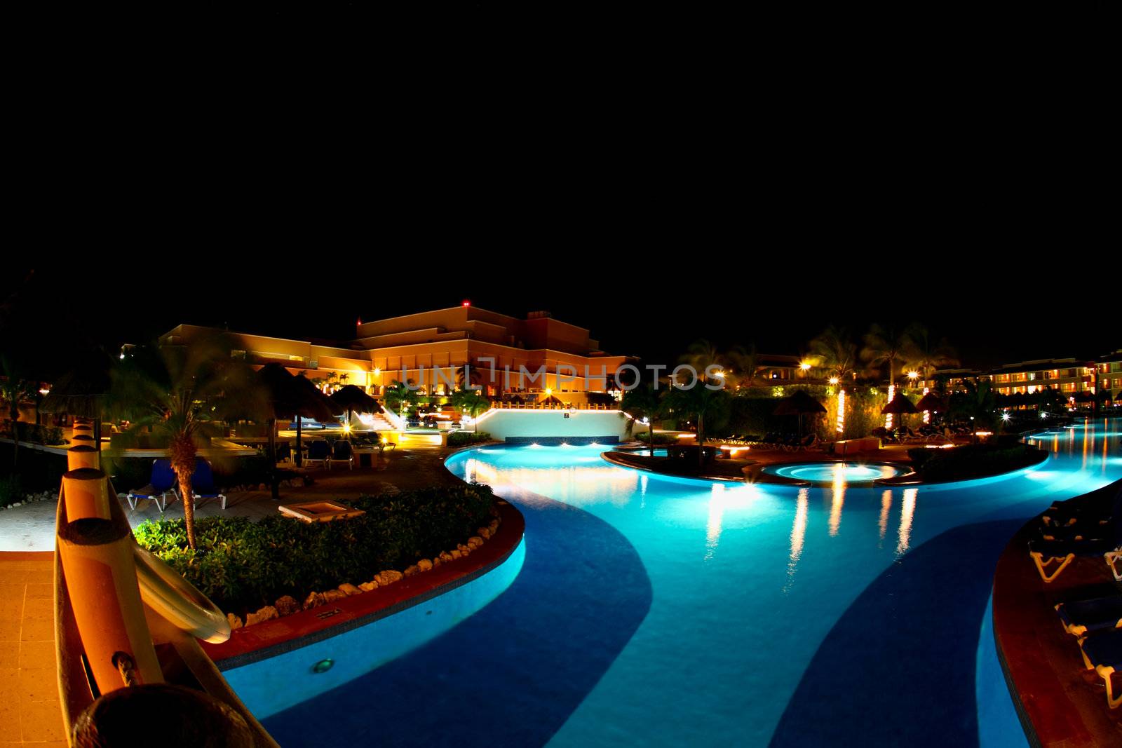 a luxury all inclusive beach resort at night in Cancun Mexico