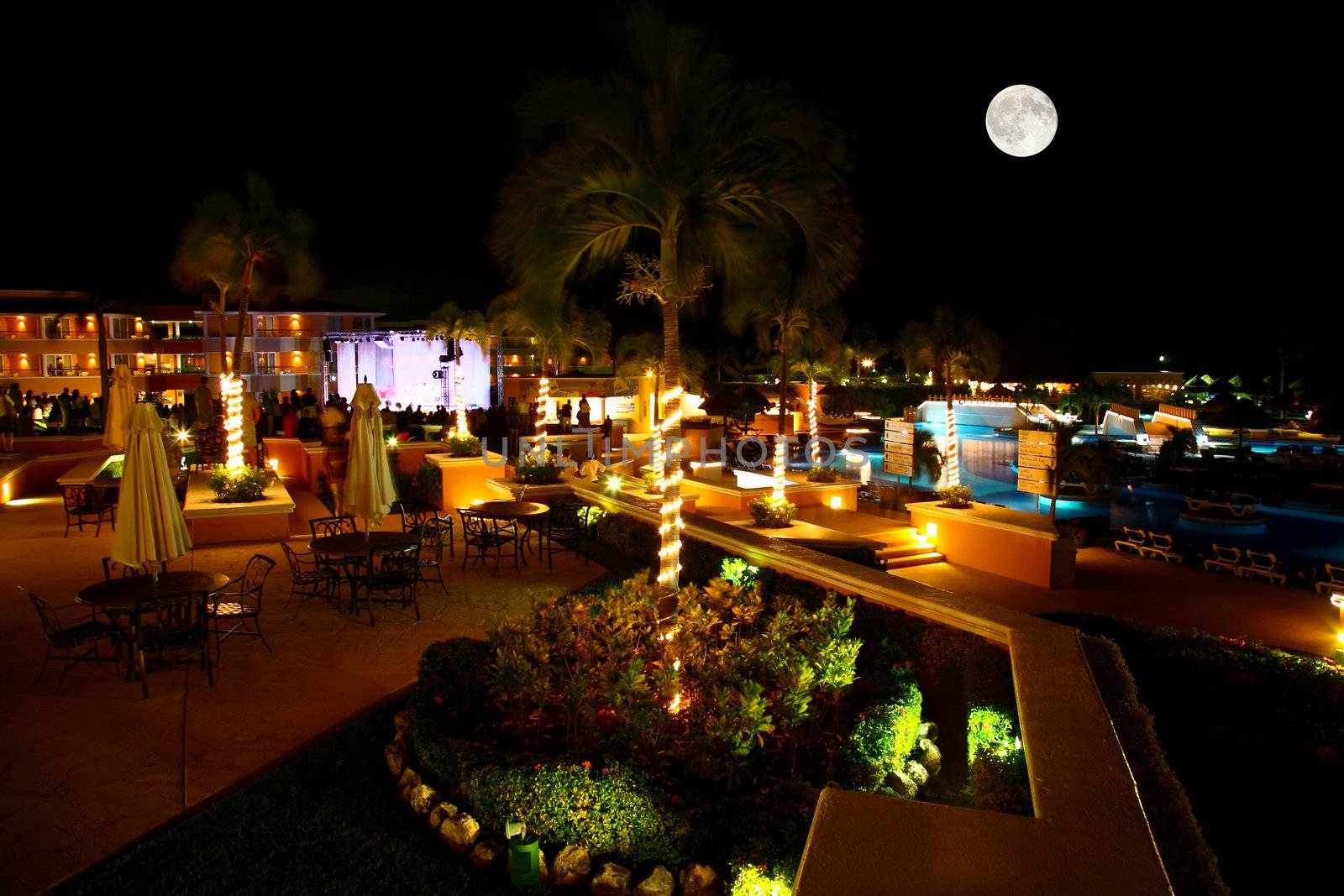 a luxury all inclusive beach resort at night by gary718