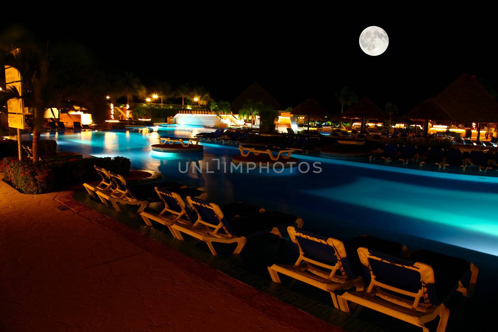 a luxury all inclusive beach resort at night by gary718