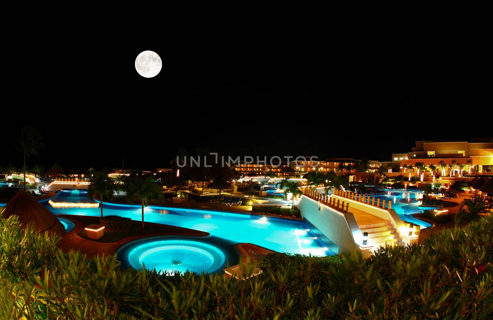 a luxury all inclusive beach resort at night in Cancun Mexico