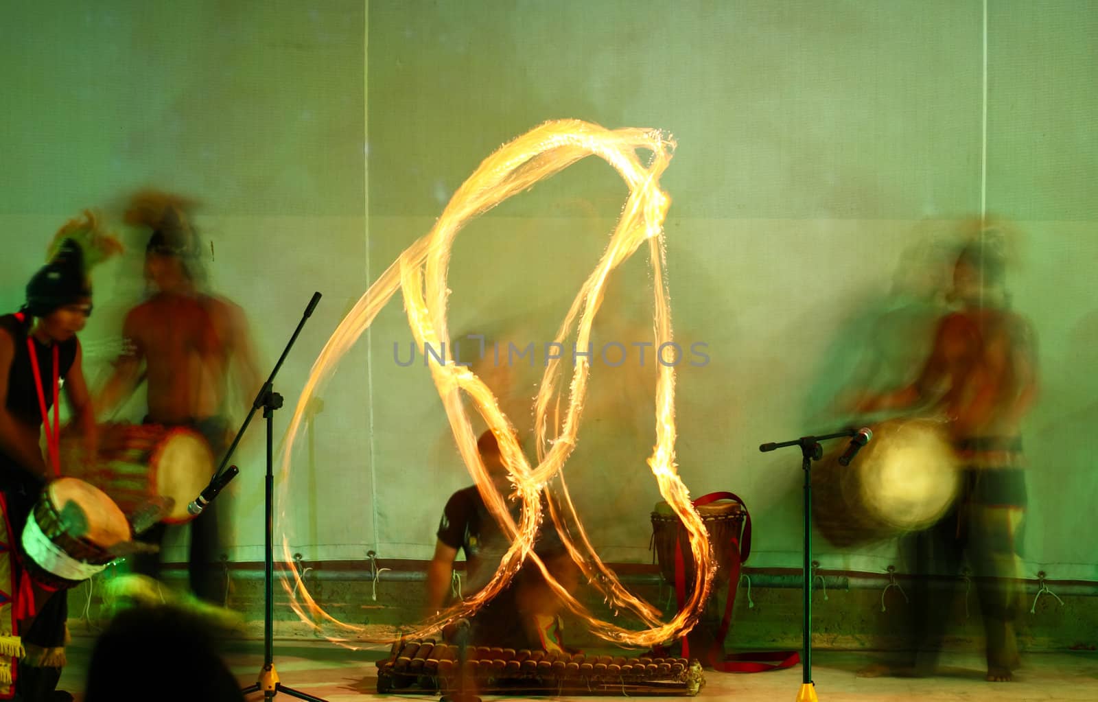 A fire show performed on stage in a beach resort