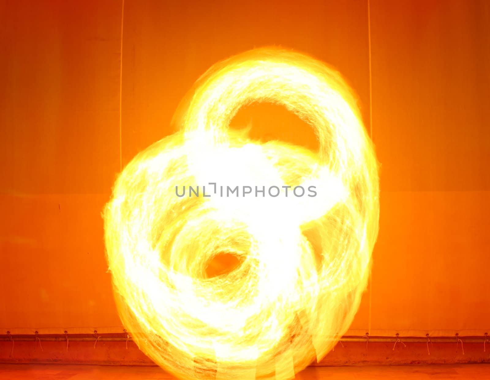 A fire show performed on stage in a beach resort