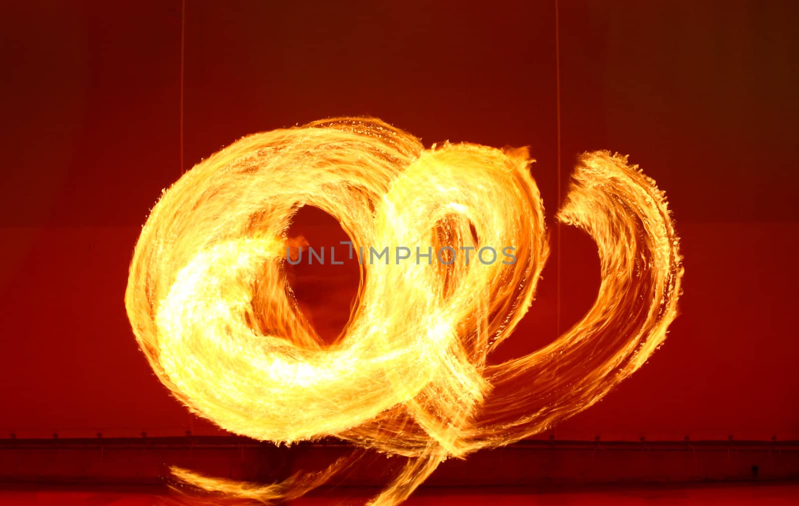 A fire show performed on stage in a beach resort