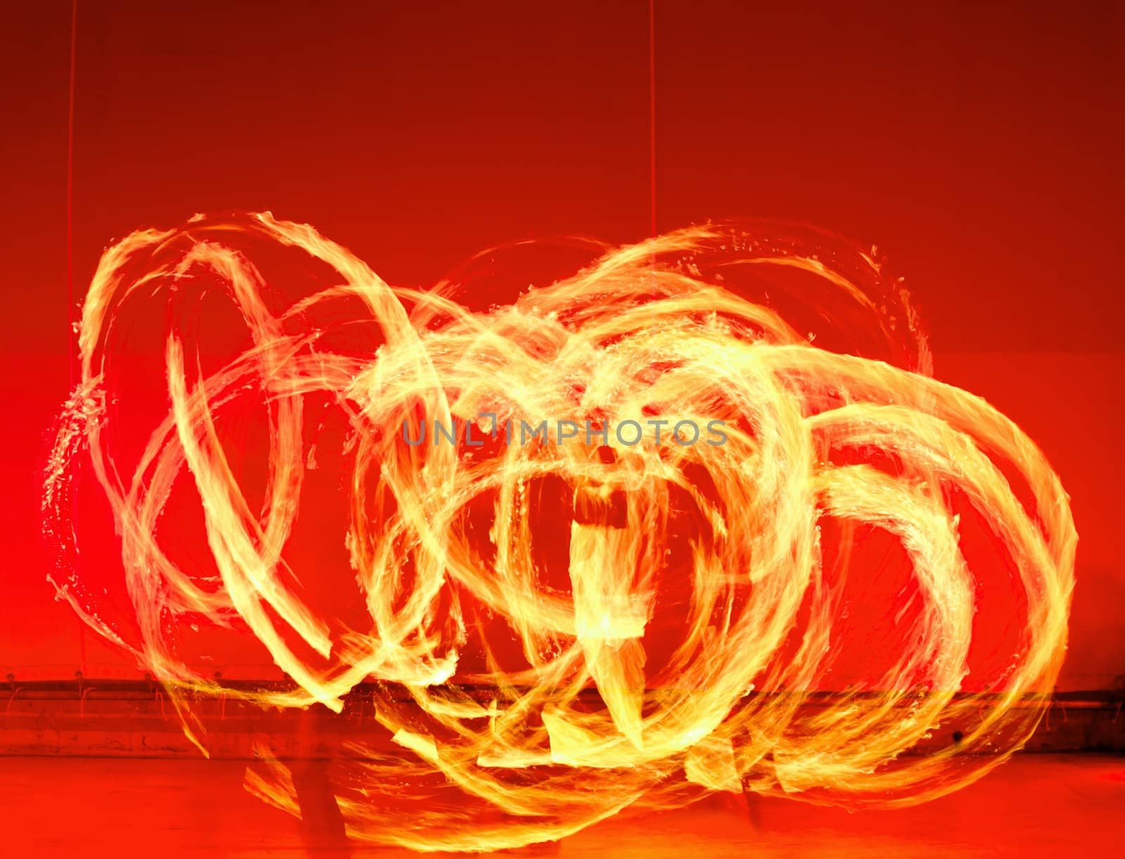 A fire show performed on stage in a beach resort