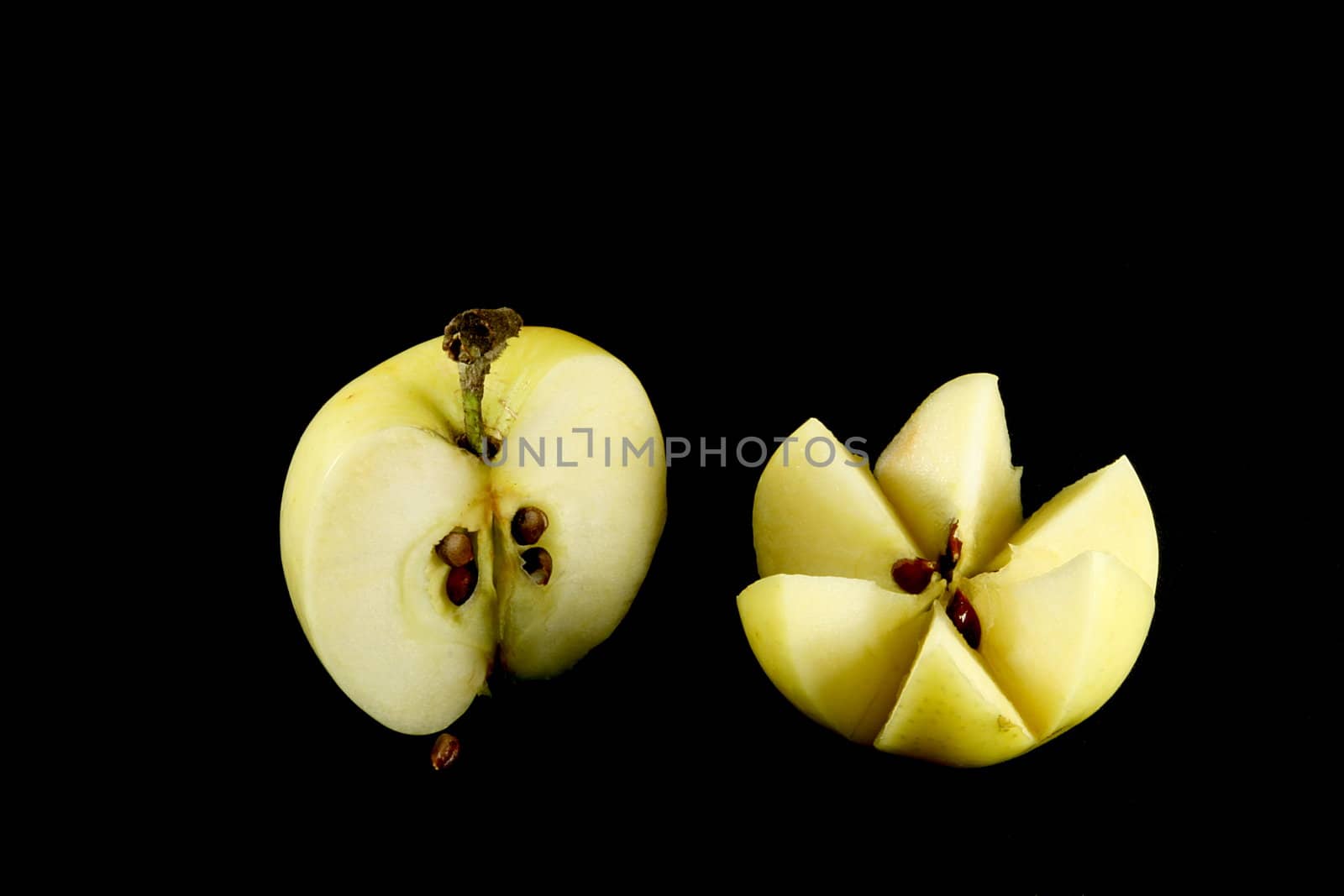 yellow apple on black background