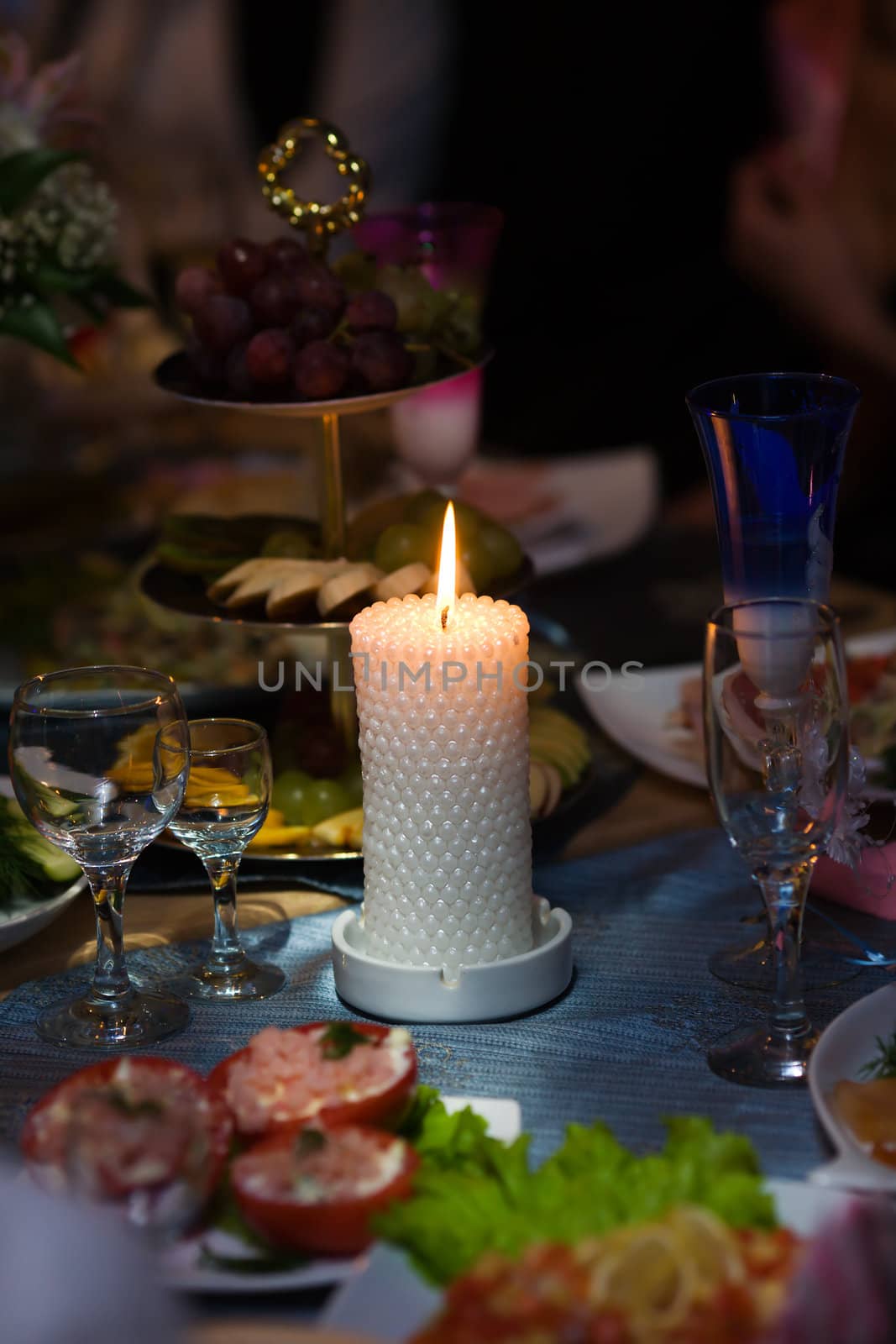 Beautiful burning candle at dinner table special event