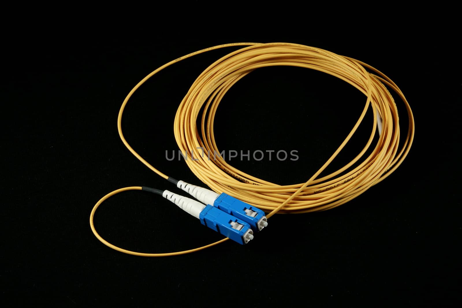 yellow fiber patch-cord isolated on black