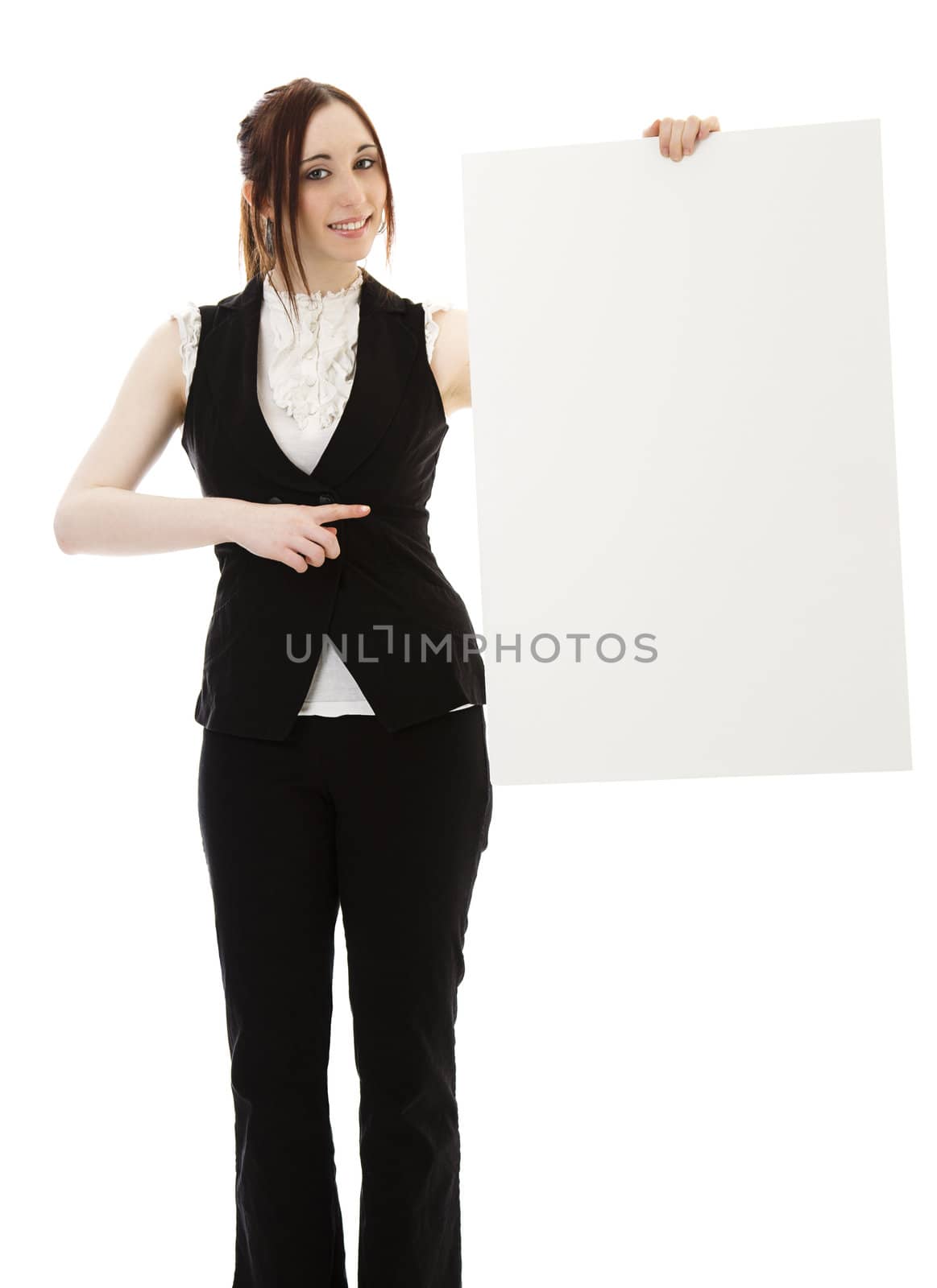 Young business woman wearing a business suit pointing at a white board against white background