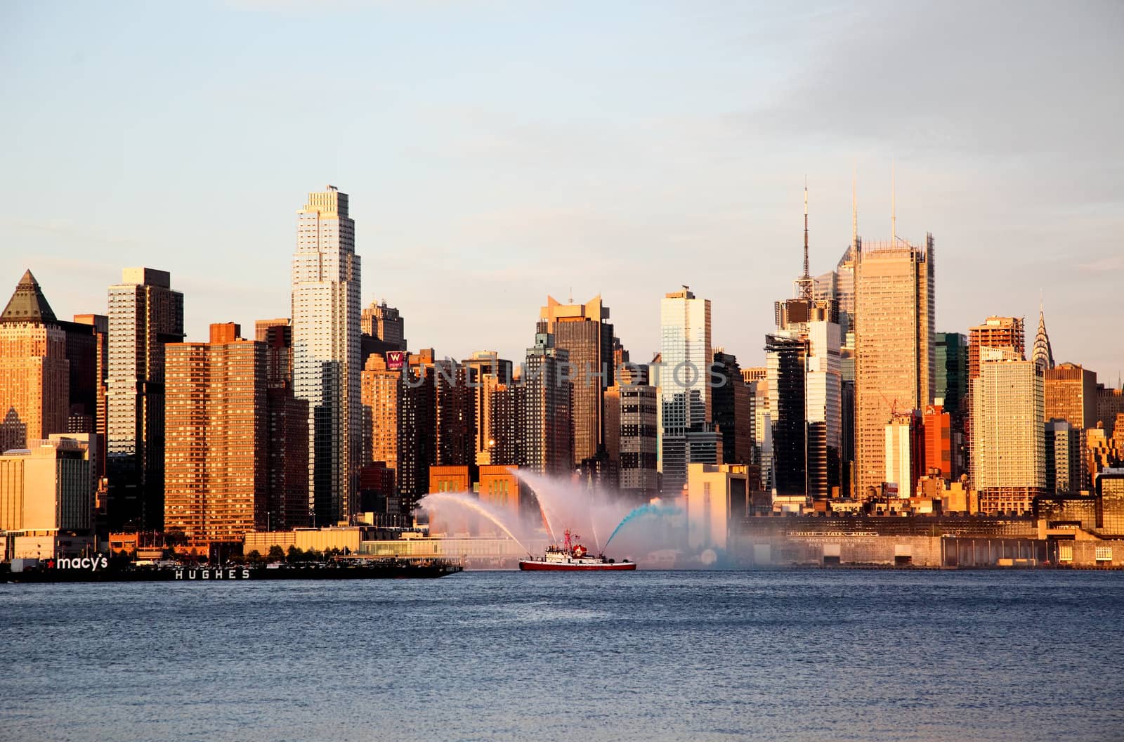 NEW YORK CITY - JULY 4, 2009: Fireboat waterjet show prior to the largest firework in the America - Macy's 4th of July fireworks which featured more than 40,000 shells.