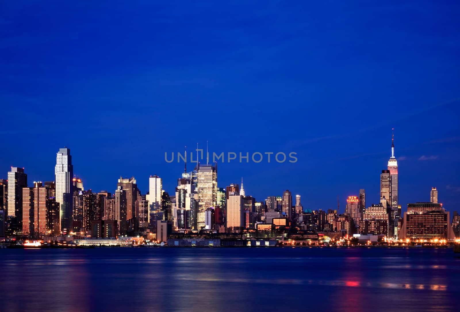 NEW YORK CITY - JULY 4, 2009: The Empire State Building lighting up red, white, and blue to observe the Independent Day.