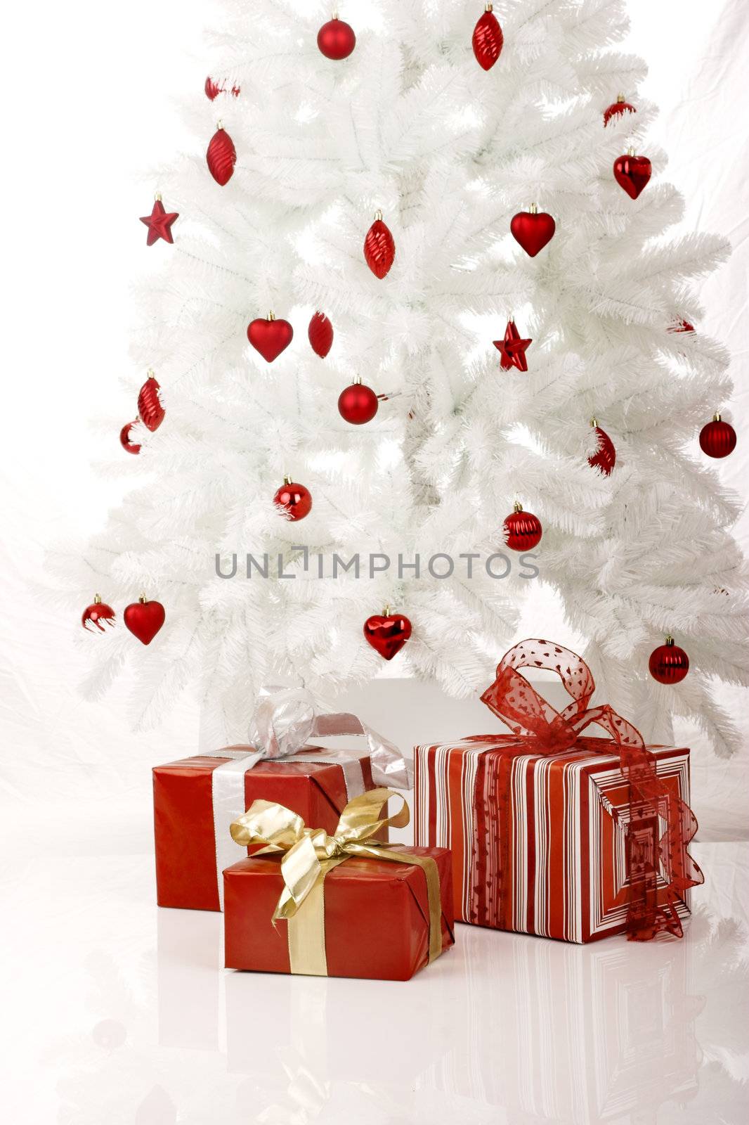 White Christmas Tree with Gifts isolated on white
