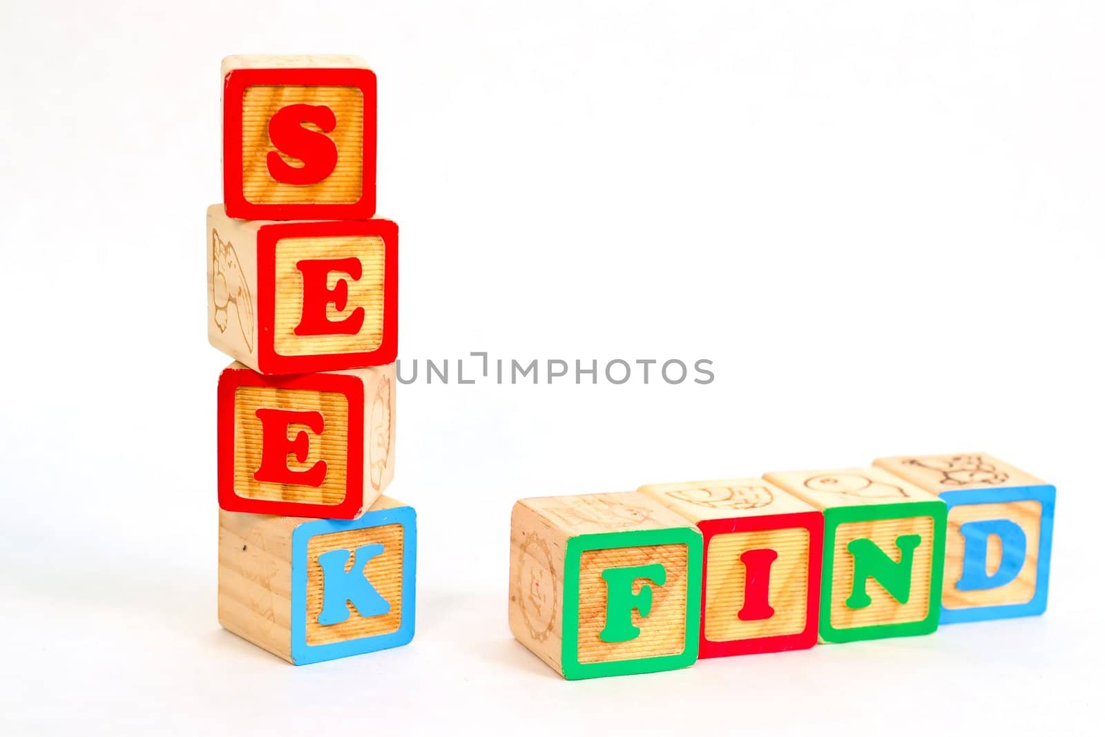 Vintage alphabet blocks spelling out SEEK and FIND